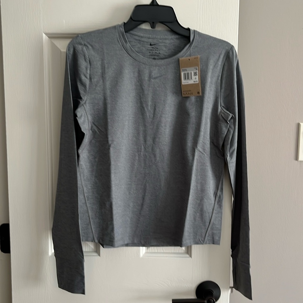 New with tags.  Nike long sleeve Dri fit Shirt.